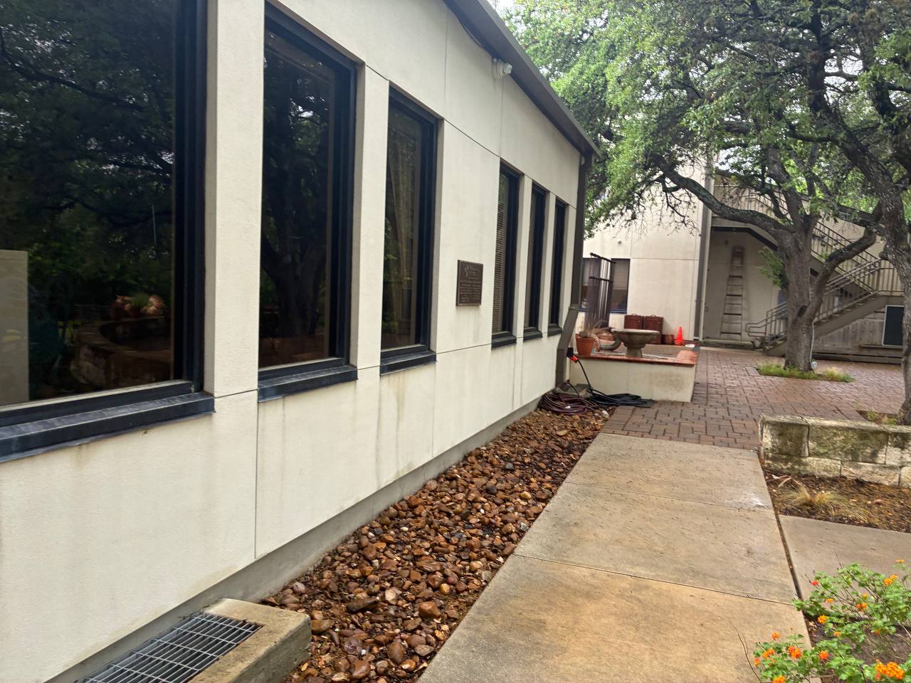 Residential exterior with walkway and perimeter grading used as a Garden Ridge foundation repair hero image